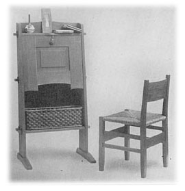 Small writing desk in green oak; desk chair in same wood, with rush seat